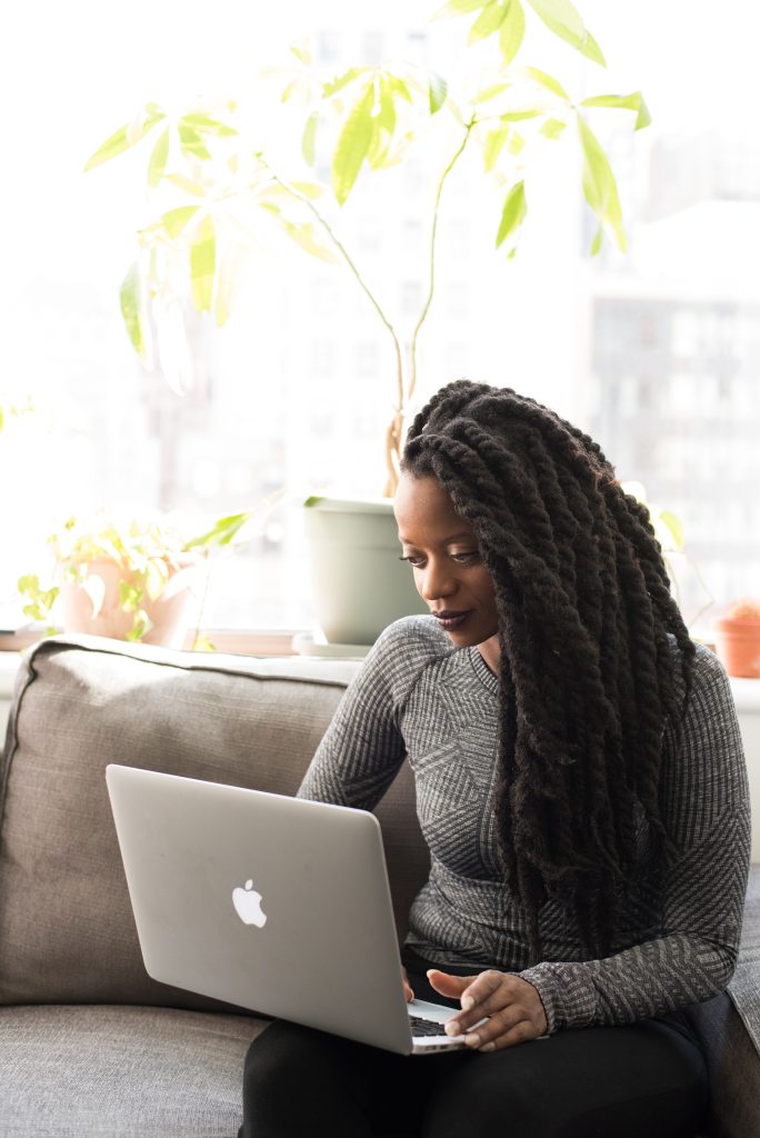 Montreal Translation Consulting Blog Post Image: Woman of color working on a computer.