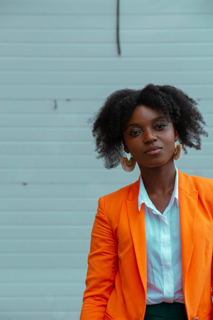 Certified Diploma Translation Blot Post Image: Woman of Color in orange blazer